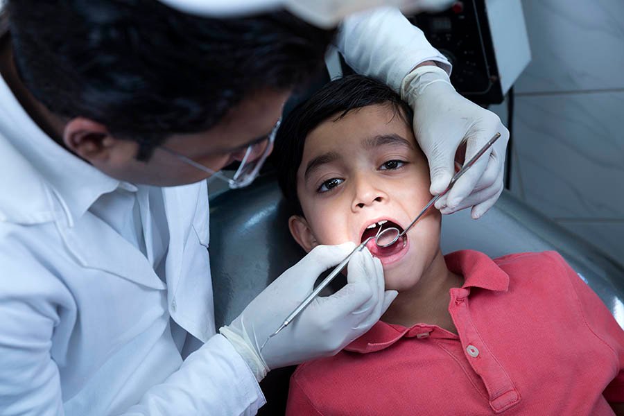 Child having a friendly dental check-up at the clinic
