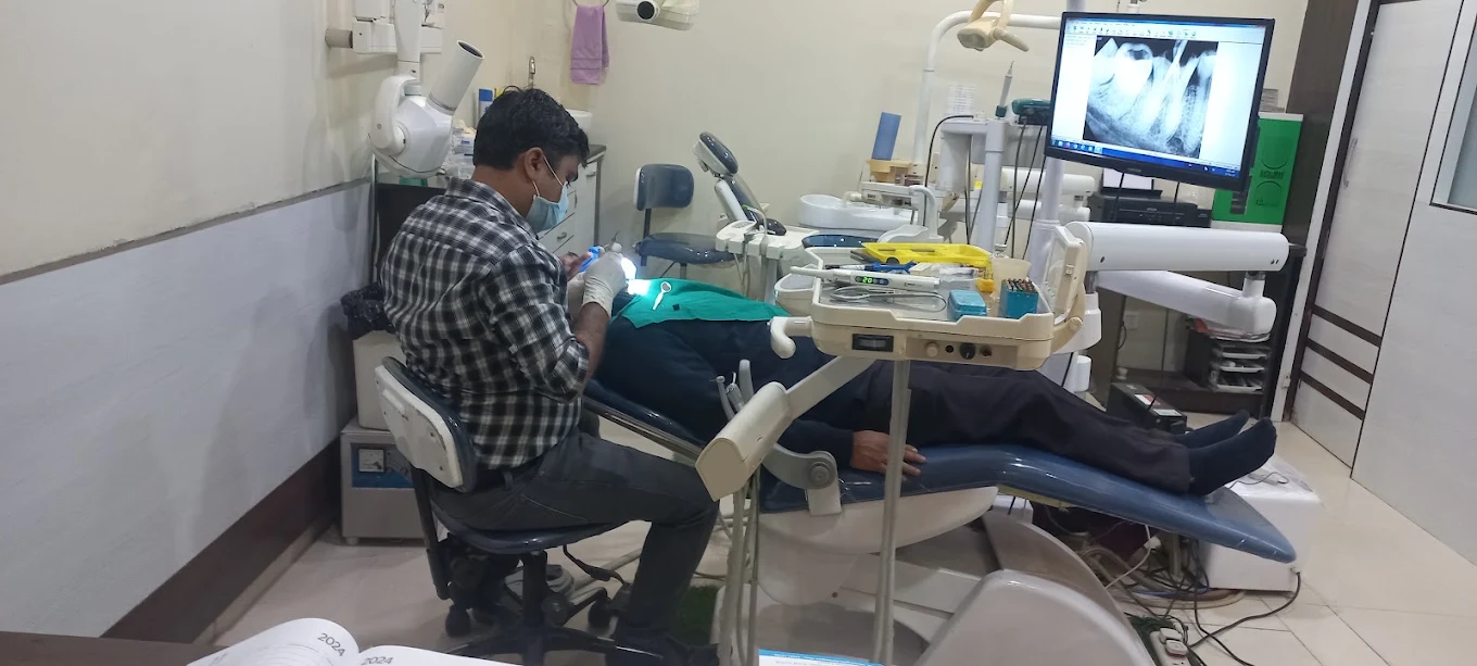 Happy patient checking her smile in a mirror at the clinic