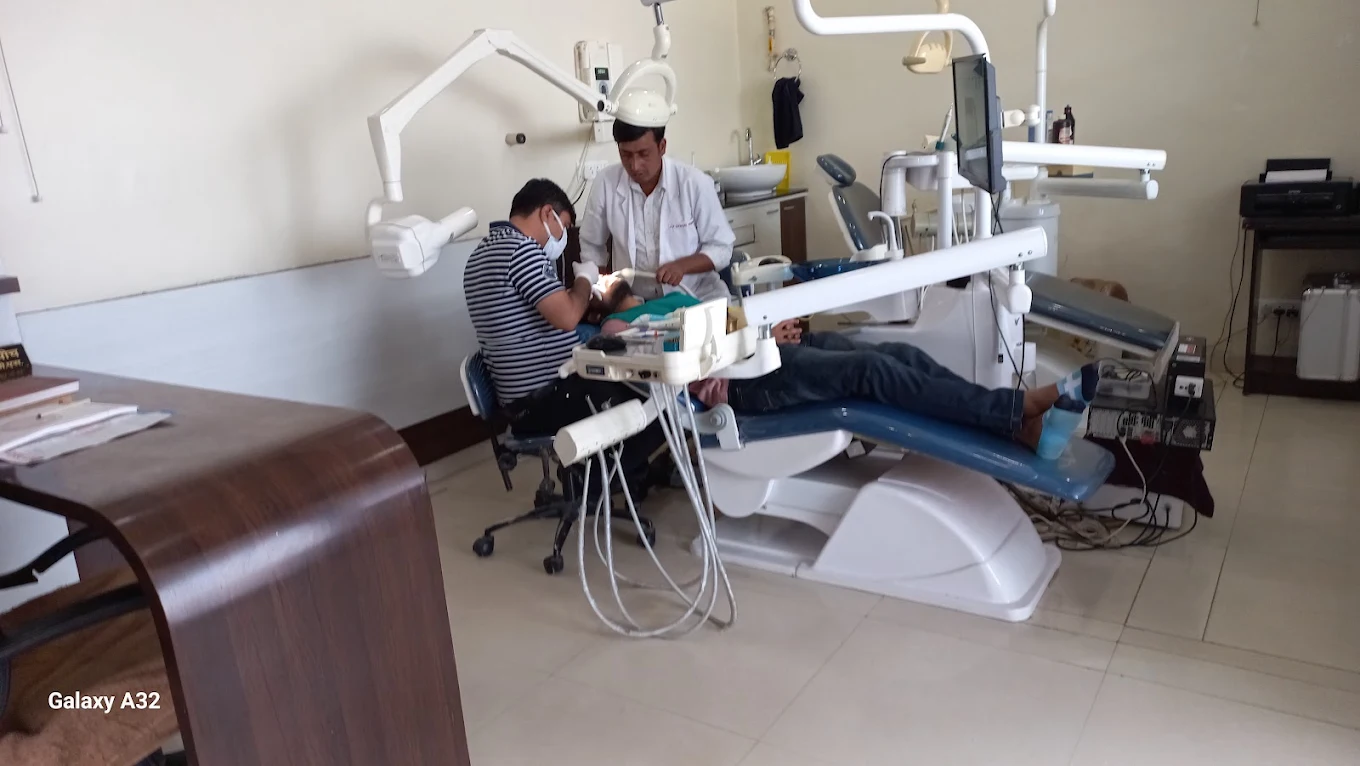 Bright, modern dental treatment room with a dental chair and equipment at DentalCare Kishangarh